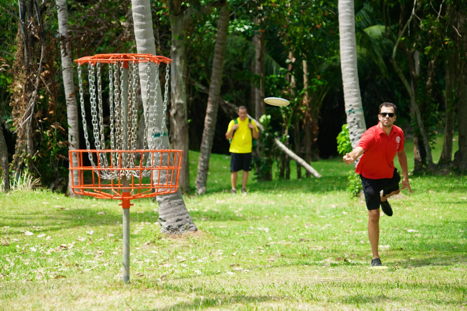 A player putts toward the chains on the beachfront course at Koh Samui