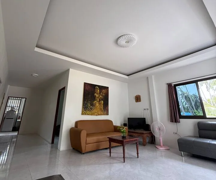 The bright, tiled living room of the guesthouse